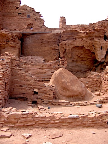 Closely stacked bricks and drainage holes are visible
