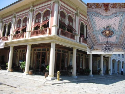 A wealthy family's house in the early 20th century with an inset showing the ornate ceiling in the dining area