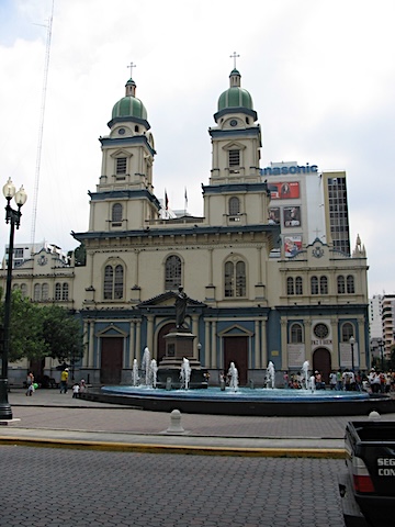 Church of San Francisco with two towers and        a fountain in front of it