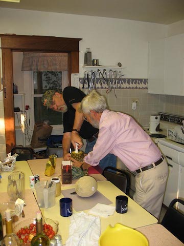 Bill and Dennis coring the pineapple