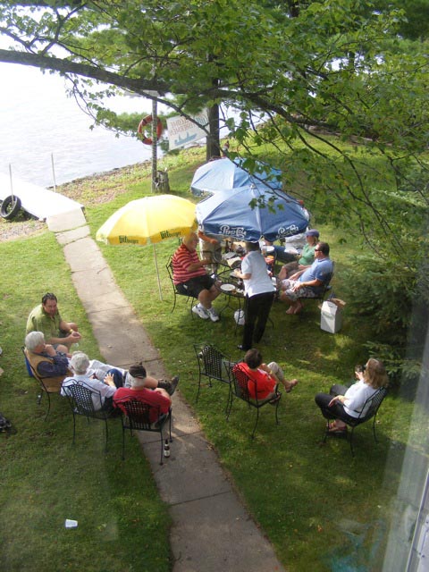 Us sitting in front of Sigrid's place, seen from the porch