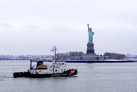 The Statue of Liberty with a Coast Guard vessel - are we free or are we guarded?