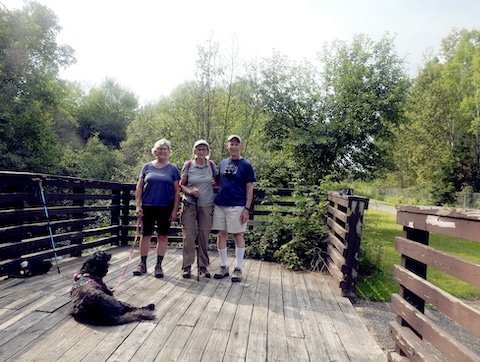 We are gathered on a deck overlooking the Iron River.                  Teddy is not looking at the camera